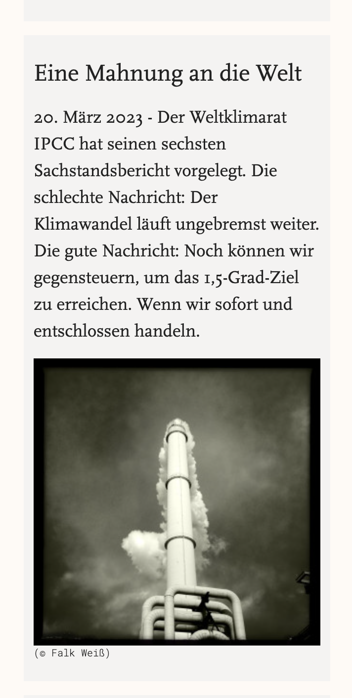 A mobile view of a news teaser. Classic serif font, warm and light look, featuring a dark black and grey photograph of an industrial chimney.