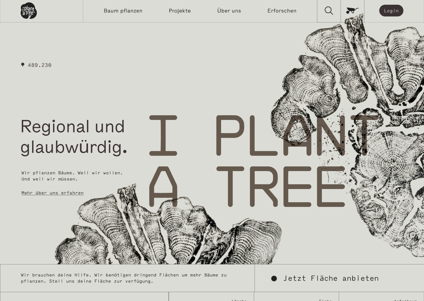 A clean startpage. It is in a warm grey ton with black and the main elements are: Two huge black prints of detailed, old tree slices and the main headline: I plant a tree in a huge, technical font.