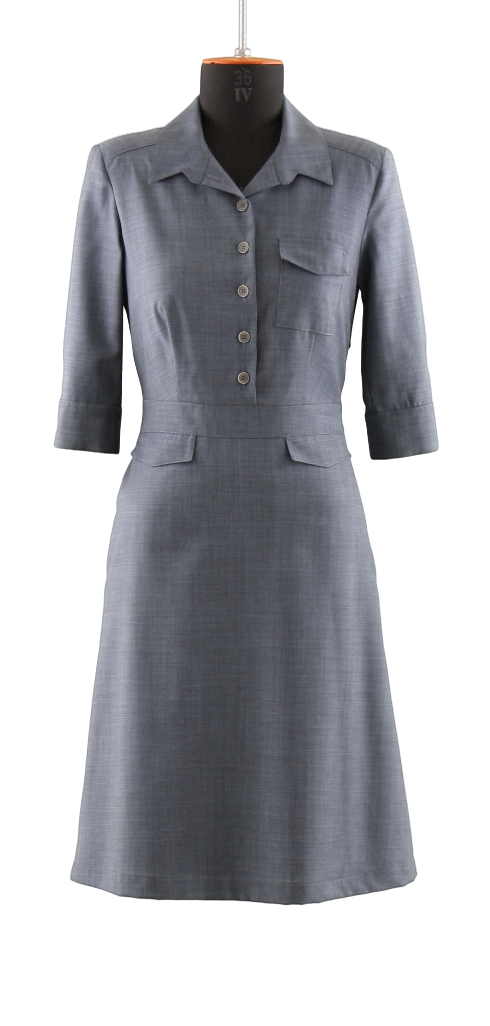 A simple grey, buttoned uniform dress belonging to the women collection with three quarter sleeves in frontal view on a headless mannequin with cutout background.