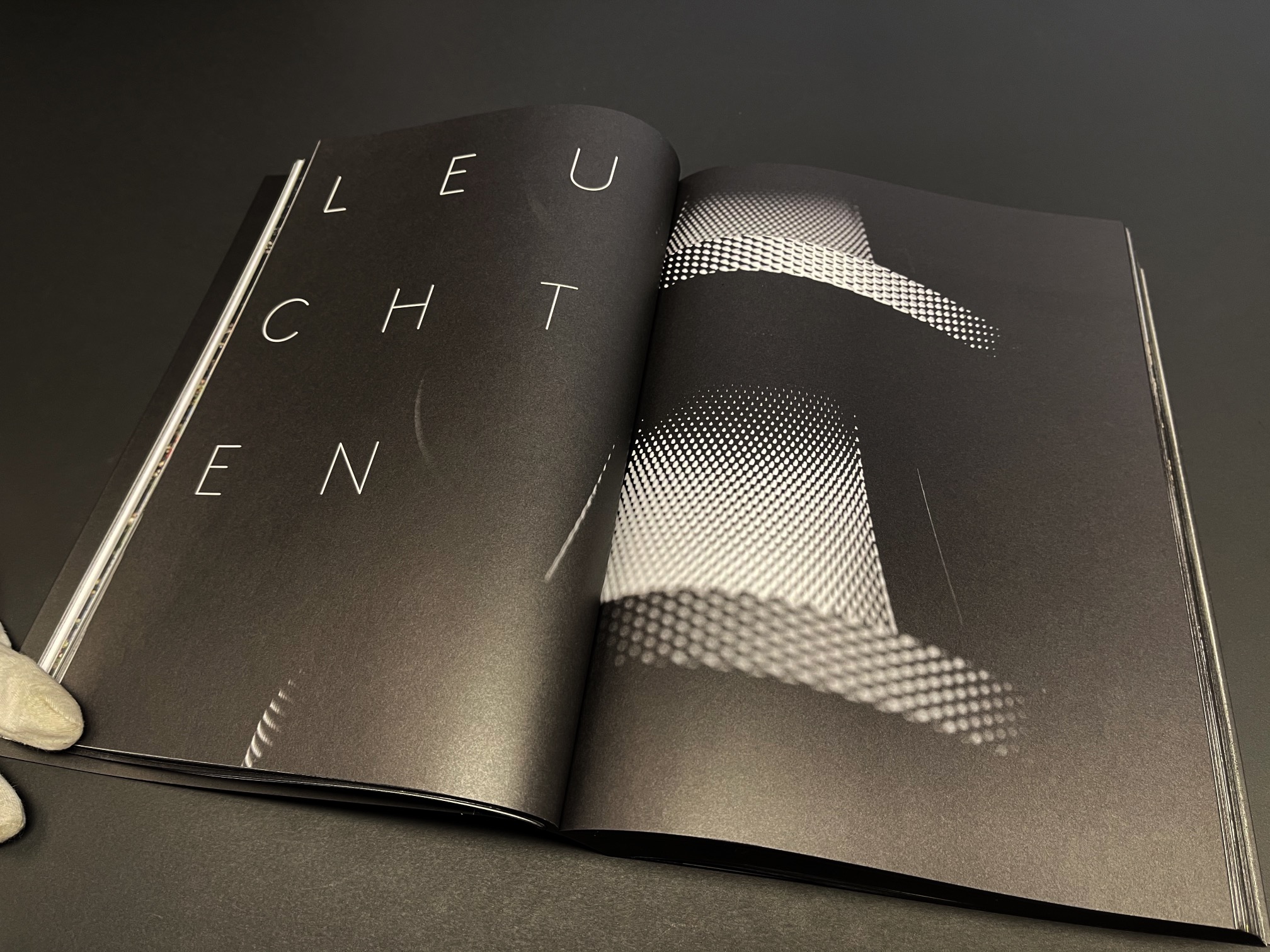An image of Selux Imagebook, showcasing a double page spread of the opening chapter on Luminaires.