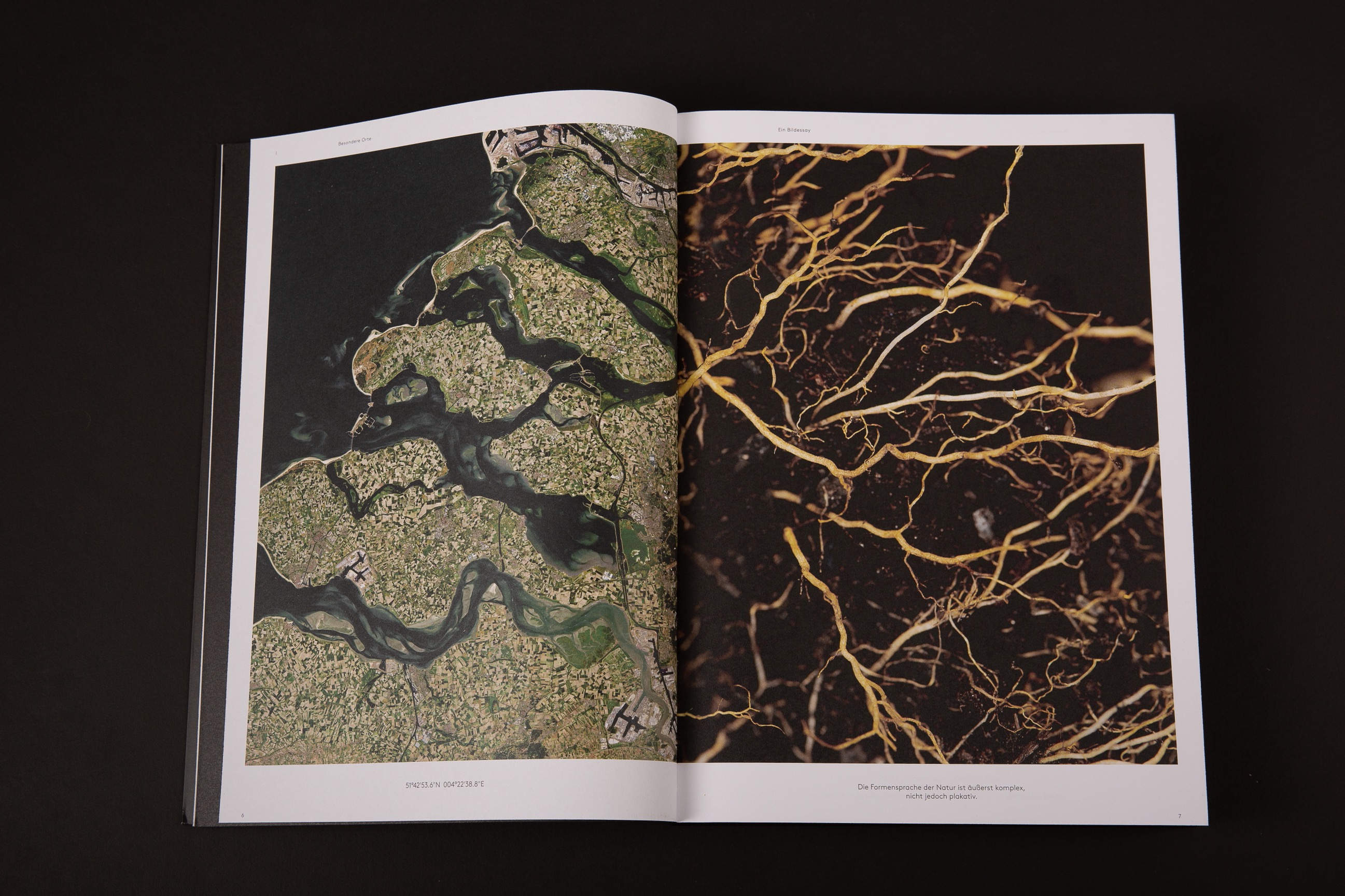 An image of Selux Imagebook, showcasing a double page spread of a satellite image and a macro image side by side with their respective coordinates underneath.